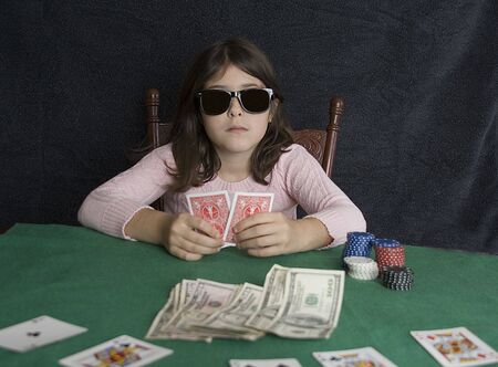 Young girl playing pokerのeditorial素材