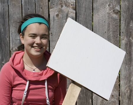 Teen Holding a Signの写真素材