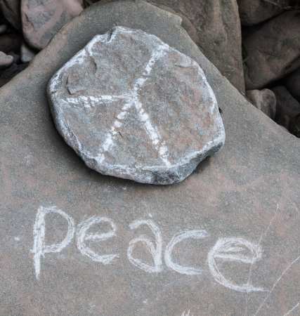 Peace written on a stoneの写真素材