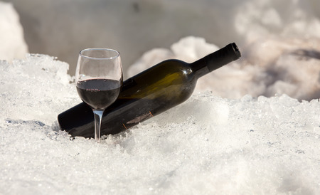 glass of red wine and bottleの写真素材