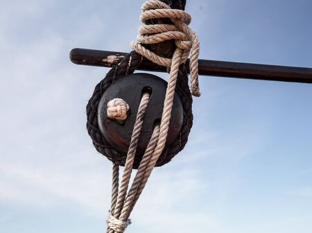 wooden pulley and ropeの写真素材