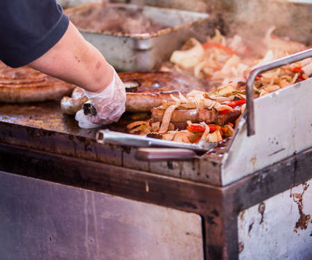 cooking sausages and onions
