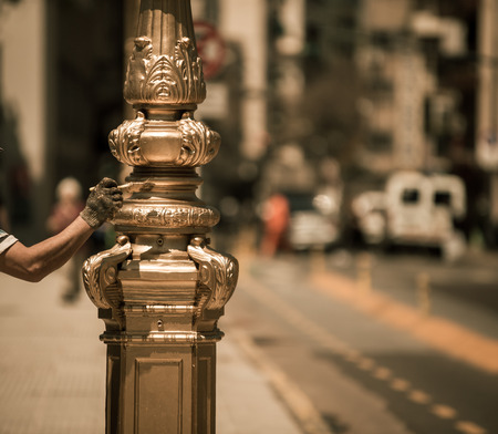 man painting a lamp postの写真素材
