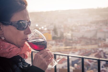 woman drinking red wineの写真素材