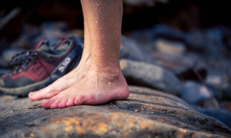 wet feet on a stone