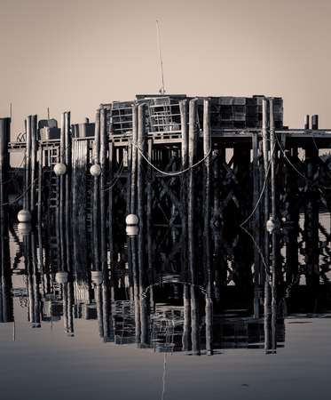 reflection old wooden pierの写真素材