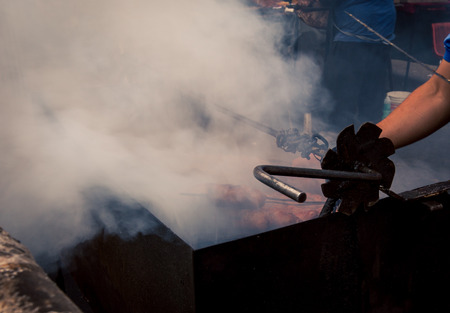 smoke from sausages grilling