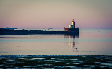 lighthouse on a pierの写真素材