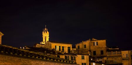 church tower at night Sienaの写真素材
