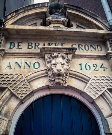lions head above doorway amsterdamの写真素材