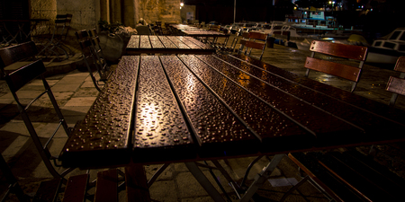 wet restaurant table at night