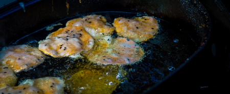 frying eggs in greaseの写真素材