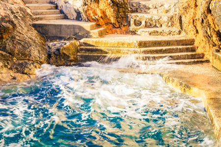 waves of the Adiatric sea hitting Dubrovnikの写真素材