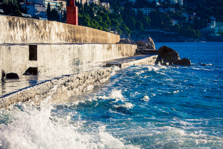 waves of the Adiatric sea hitting Dubrovnikの写真素材