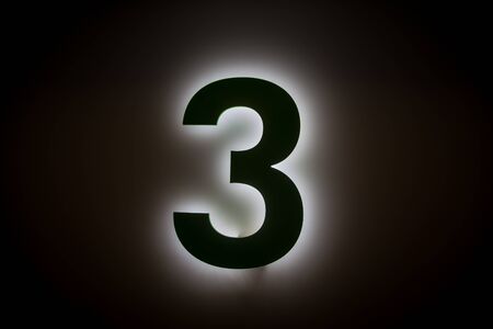 glowing number threeの写真素材
