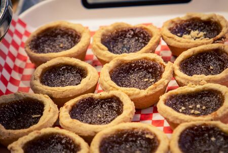 fresh homemade butter tarts at a market