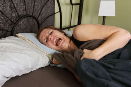 young woman has bad dreamsの写真素材