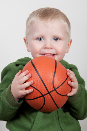 little boy with basketballの写真素材