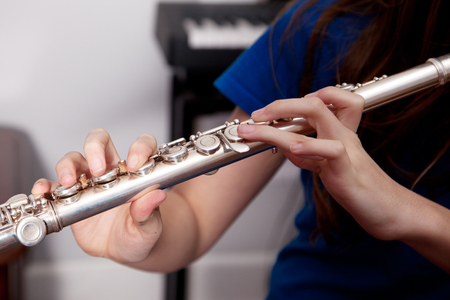 Close up of a flautist playing a flute.の写真素材