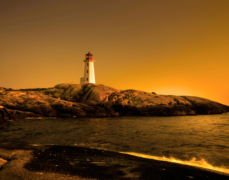 golden sunset view of the famous landmark peggy's cove in nova scotia, canadaの写真素材