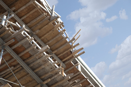 wood planks and beams in a row on a construction building