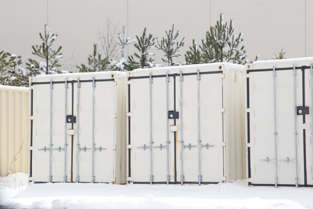 beige storage units or containers outside in winter