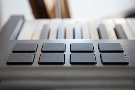 A digital piano keyboard with midi pads for creating sounds