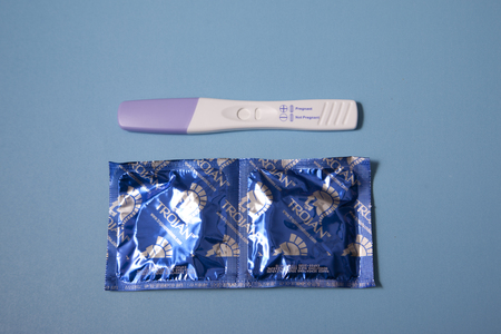 Halifax, Canada- June 1, 2019: Pregnancy protection with pregnancy test and Trojan condomsのeditorial素材
