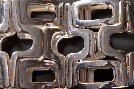 Interesting pattern on a silver wrist braceletの写真素材