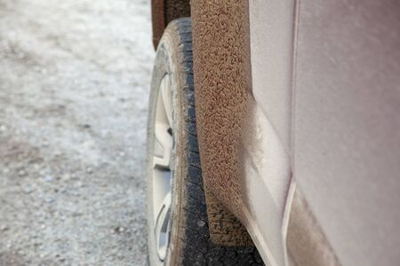 off roading adventure with muddy flaps and wheels on the dirt road