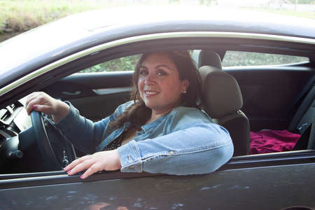 beautiful woman getting out of town and driving while smiling beautifully