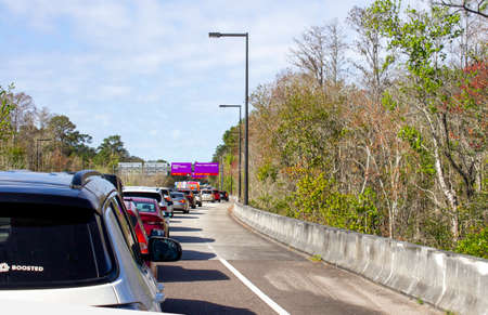 February 23, 2020 - Orlando, Florida: Line of traffic cars waiting to get in to Disneys Animal...