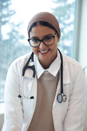 portrait of a beautiful doctor with head scarf and stethascope