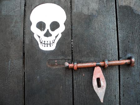 Painted Skull on Unlocked Doorの写真素材