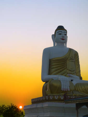 Burma (Myanmar) Hazy Sunset by Buddha Statueの写真素材