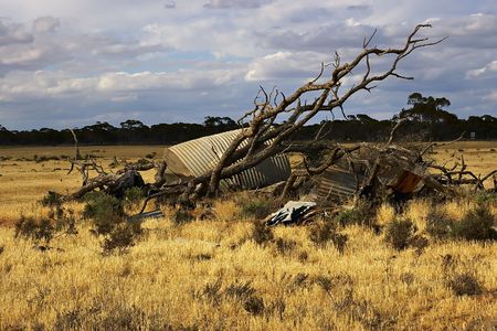 pile of old rubbish and scrap in the middle of a paddockの写真素材