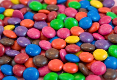 background pile of smarties chocolatesの写真素材