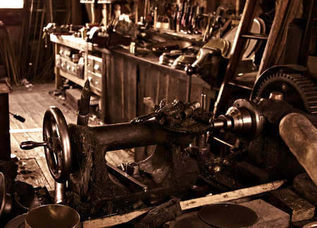 an old busy and cluttered workshop in russet