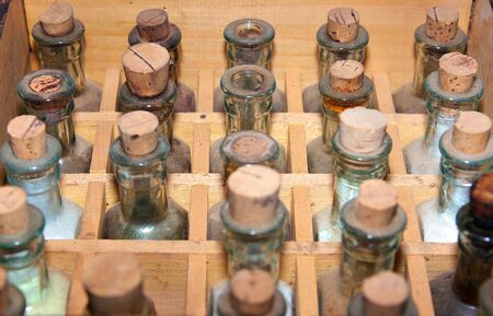 rows of old medicine bottle with cork stoppers の写真素材