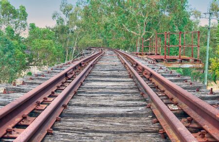 looking along the tracks on the railway bridgeの写真素材