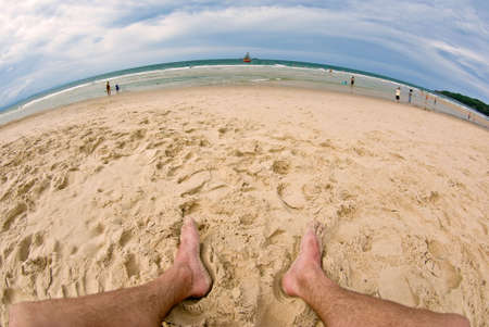 when you are on top the world you might as well sit on the beachの写真素材