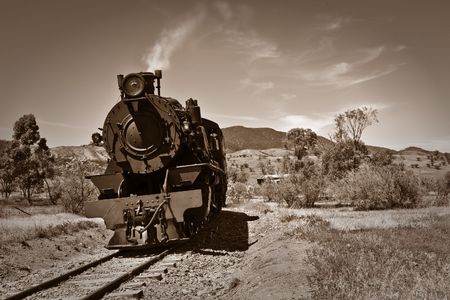 sepia brown image of an old steam train 