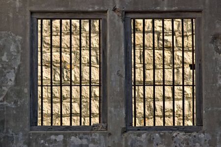 hopeless outside the jail cell is a stone wallの写真素材