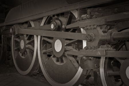 great steam train locomotive wheels closeup image in balck and white