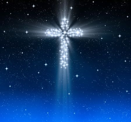 great glowing christian cross in starry night skyの写真素材