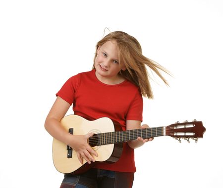 young girl playing the guitar on white backgroundの写真素材