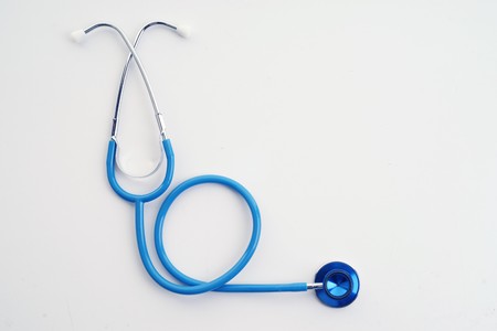 great image of a blue stethoscope on whiteの写真素材