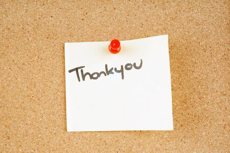 great image of a thankyou note pinned to a corkboardの写真素材