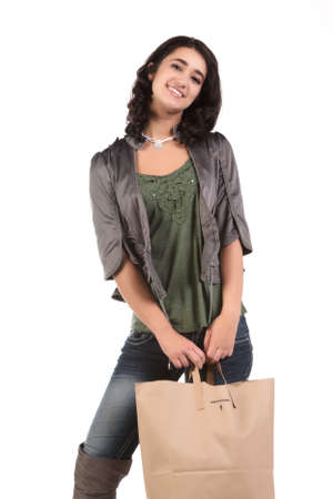 beautiful young teenage woman with shopping bagの写真素材