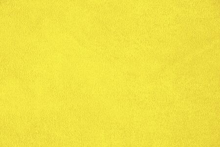 Texture of natural yellow suede. Leather background.の写真素材